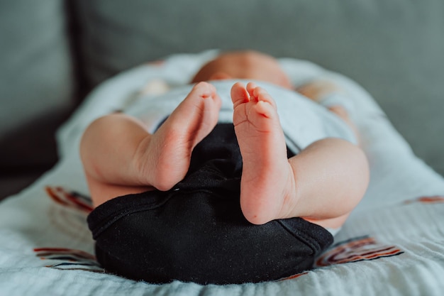 Cute little feet of a newborn baby