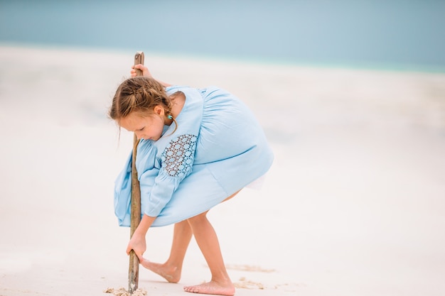 Cute little girl at beach during caribbean vacation