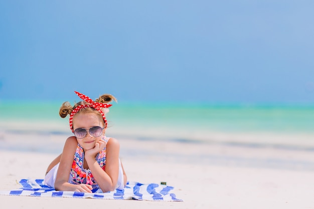 Cute little girl at beach during caribbean vacation