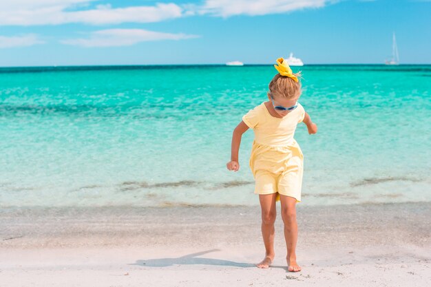 Cute little girl at beach during summer vacation