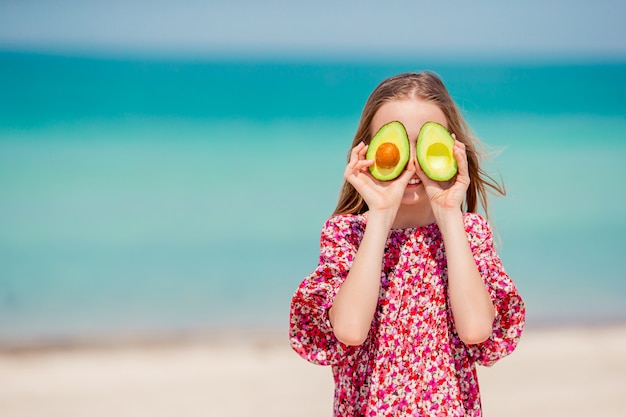 Cute little girl at beach during summer vacation