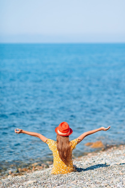 Cute little girl at beach during summer vacation