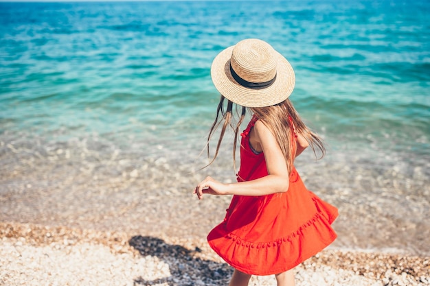 Cute little girl at beach during summer vacation