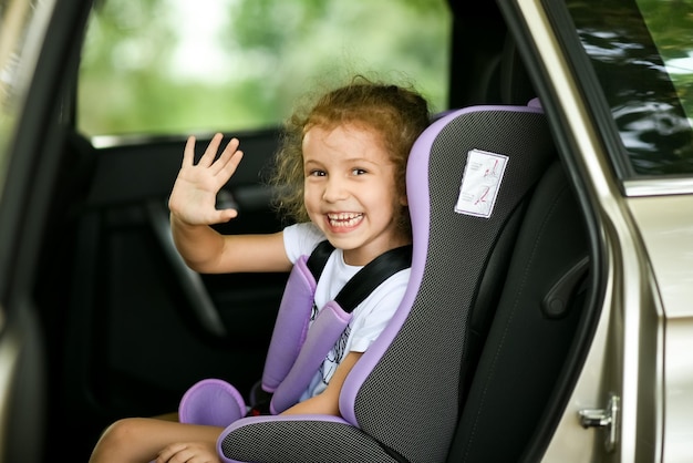 Cute little girl in the car. Journey. Vacation.