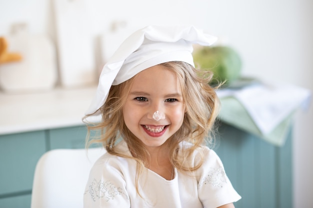 Cute little girl in the cook chef costume