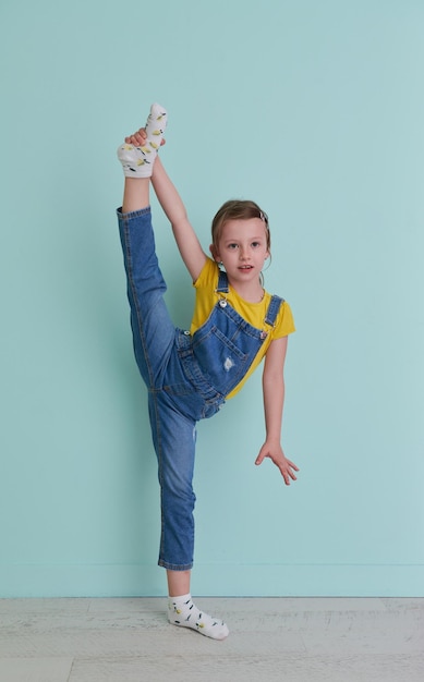 Cute little girl dancing ballet at home