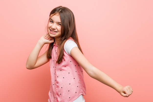 Cute little girl dancing and having fun.