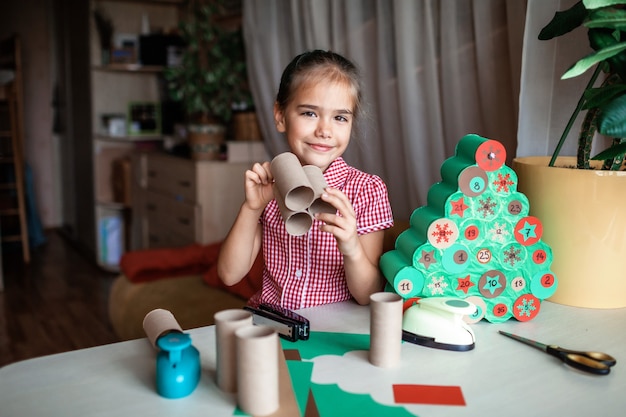 Cute little girl doing Christmas decorations