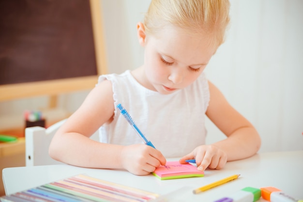 Cute little girl doing homework