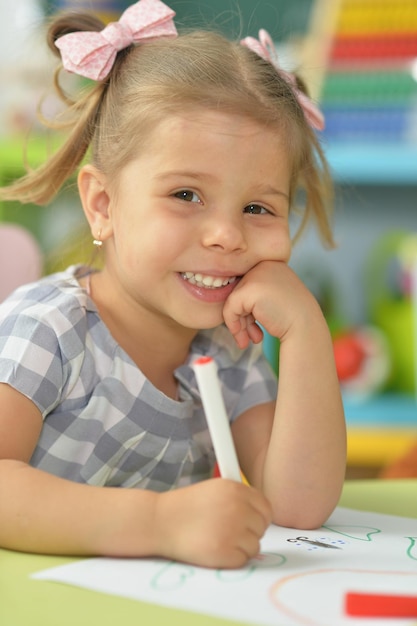 Cute little girl drawing with felt pen