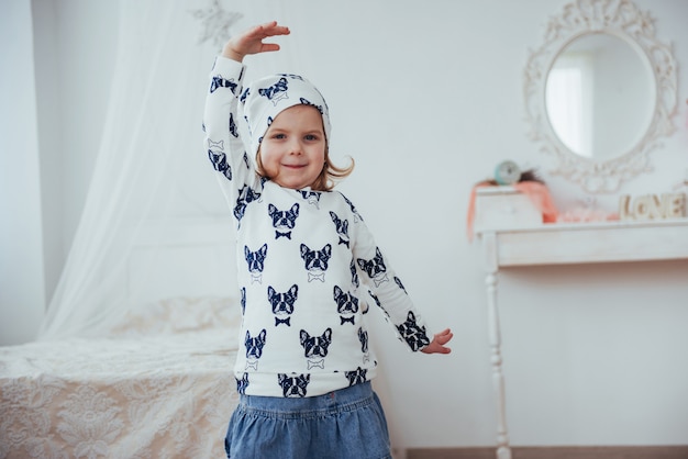 Cute little girl dreams of becoming a ballerina. Girl studying ballet.