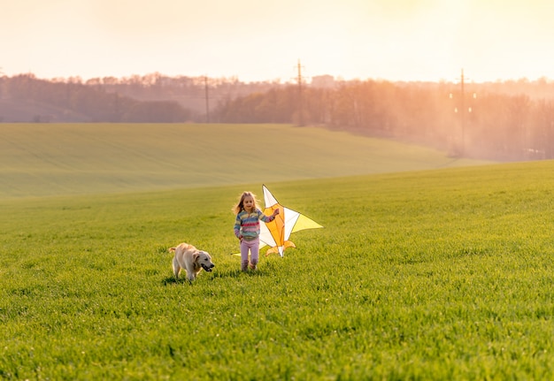 Cute little girl flying kite