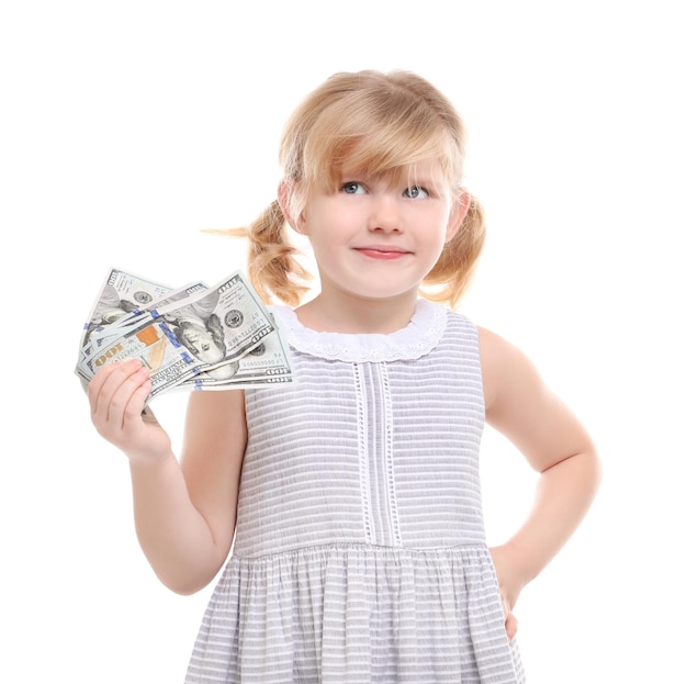 Cute little girl holding money on white background