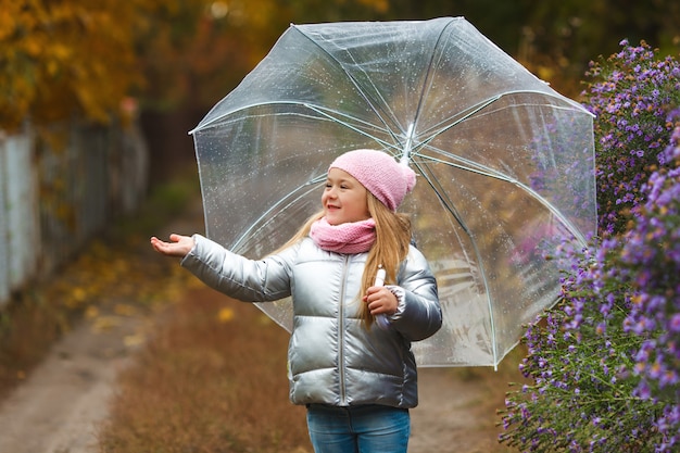 cute little girl holding an umbrella