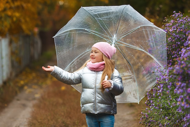 Cute little girl holding an umbrella