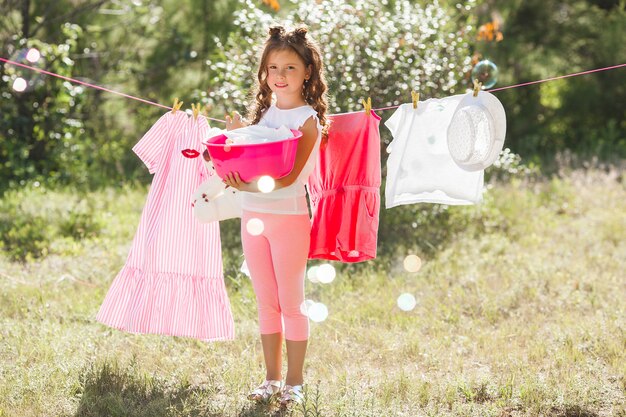 Cute little girl laundring