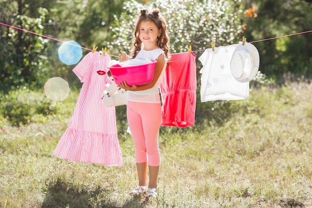 Cute little girl laundring