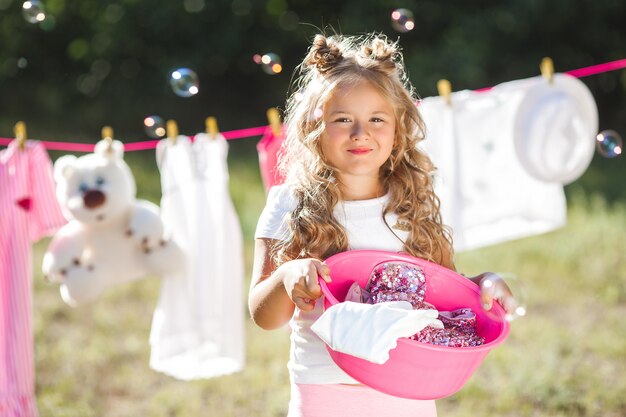 Cute little girl laundring