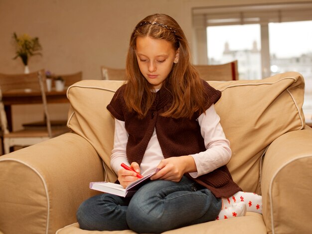 Cute little girl painting at home