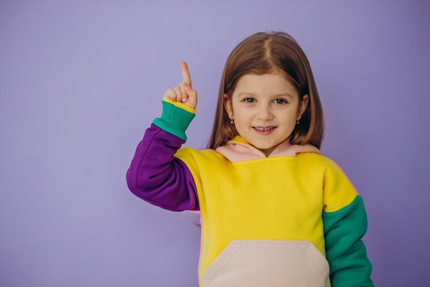 Cute little girl showing emotions isolated in studio