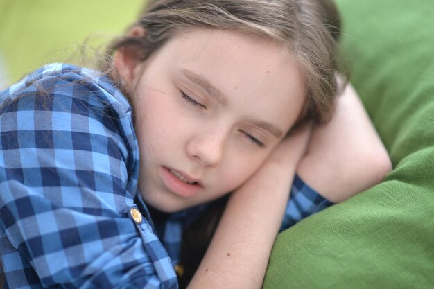 Cute little girl sleeping in bed at home