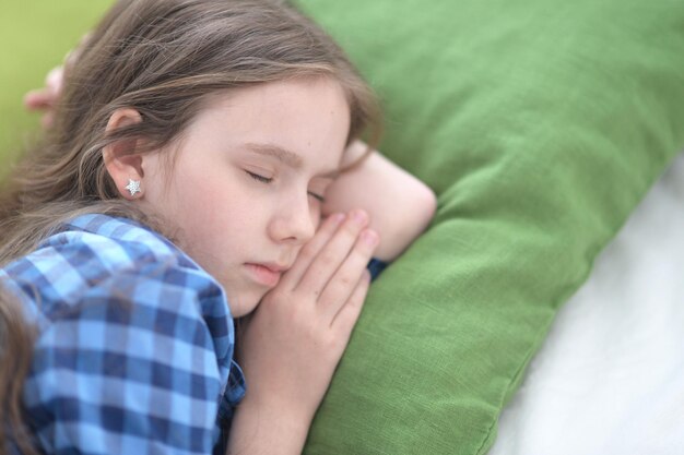 Cute little girl sleeping in bed at home