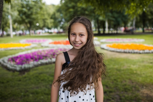 cute little girl smiling in nature park