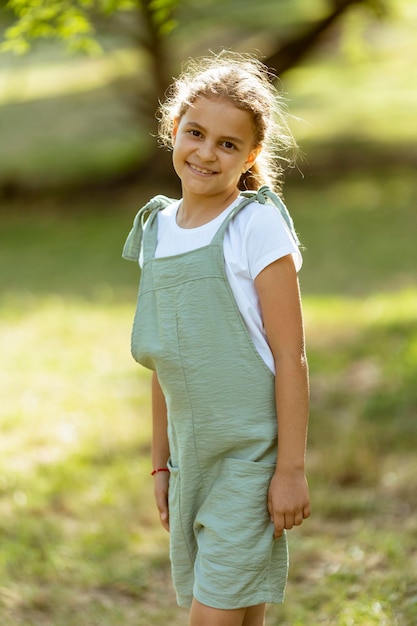 Cute little girl standing in the park