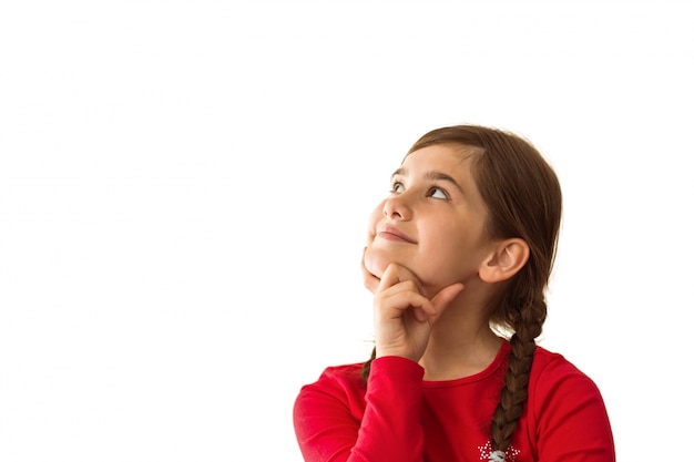 Photo cute little girl thinking and looking up