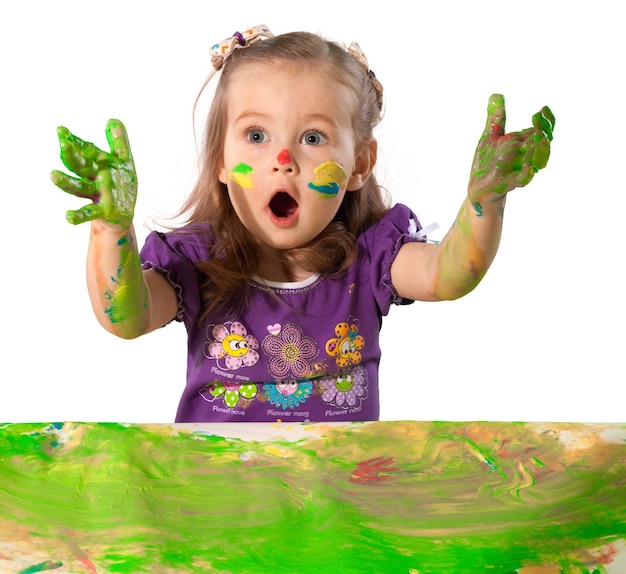 Cute little girl with colorful painted hands on  background