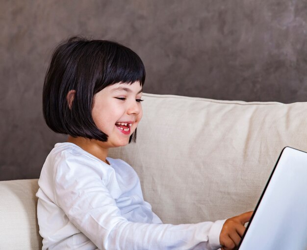 Cute little girl with laptop