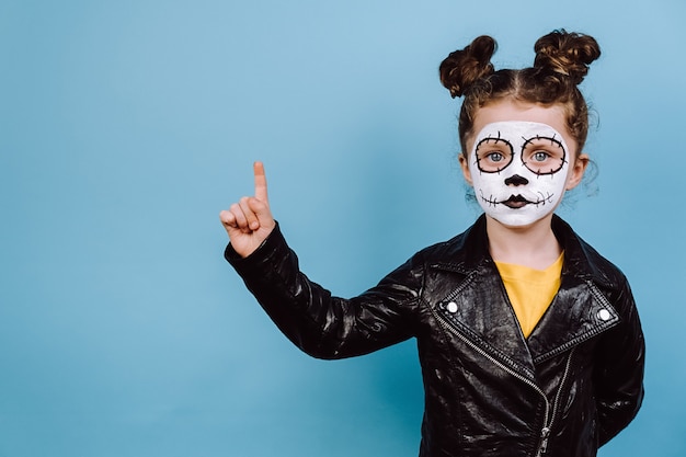 Cute little girl with scary make up for Halloween