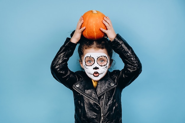 Cute little girl with scary make up for Halloween