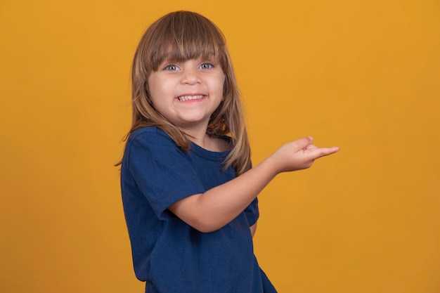 Cute little girl with straight hair smiling with free space for text