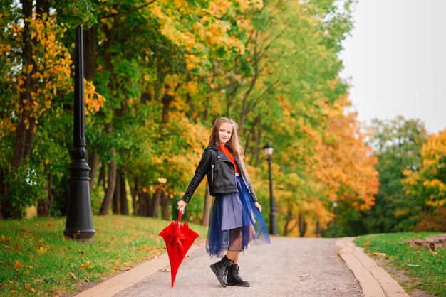 Cute little girl with umbrella. Weather forecast conception