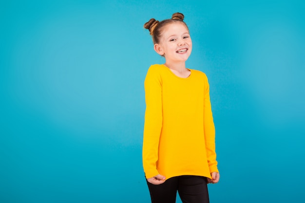 Cute little girl in yellow pullover