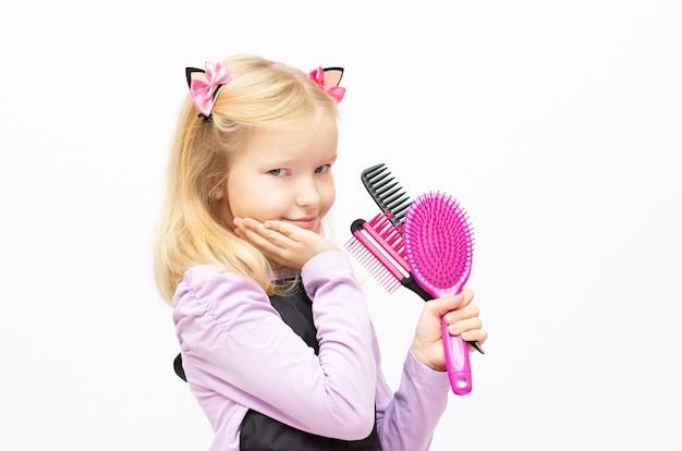 Cute little hairdresser on white background