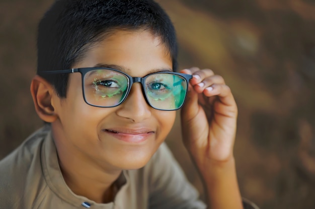 Cute little Indian / Asian boy wearing spectacles