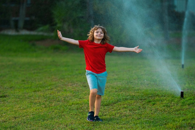 Cute little kid play in garden at summer day summer dream kid dreams on grass childhood dream