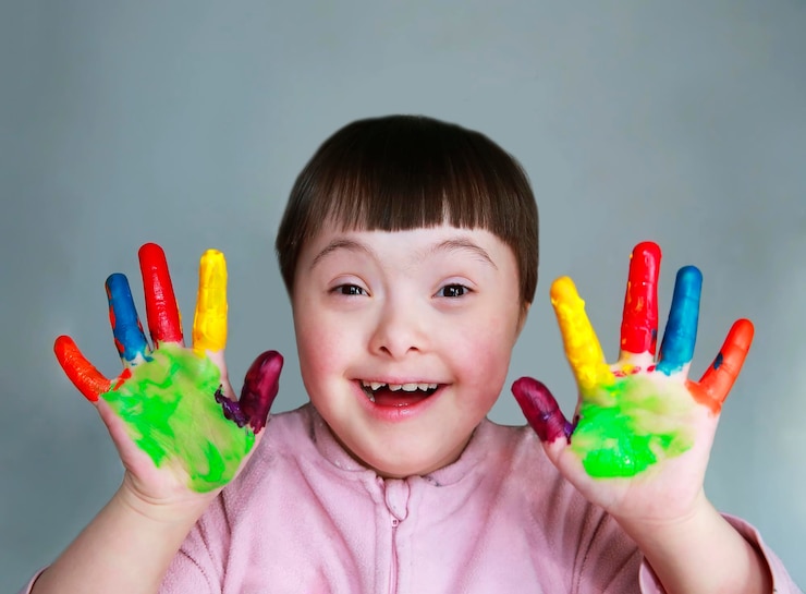 Photo cute little kid with painted hands. isolated on grey background.