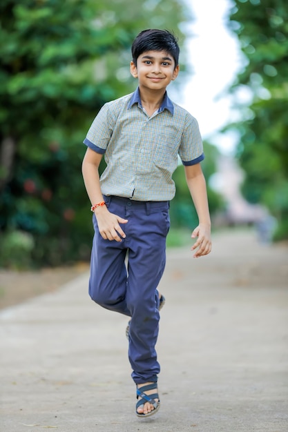 Cute little school boy wearing uniform