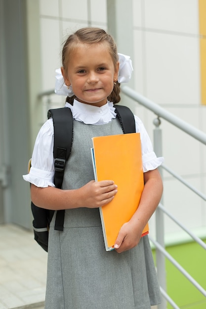 Cute little schoolgirl in her uniform