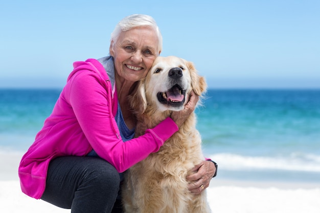 Cute mature woman petting her dog