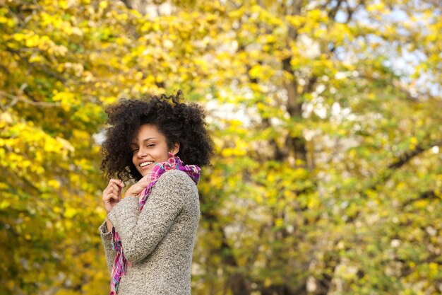 Cute mixed race woman smiling outdoors in nature