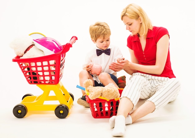 Cute mother and child boy plays together. Family relationships. Playing supermarket. Mother play with son.