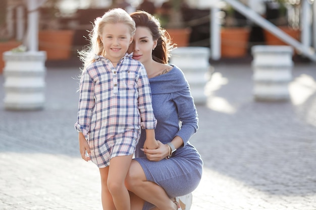 cute mother and her daughter outdoor