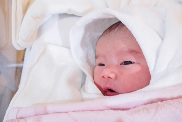 Cute newborn asian baby girl