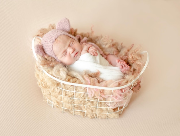 Cute newborn baby girl studio portrait