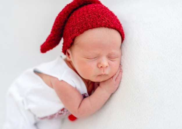 Cute newborn wearing emboidered shirt