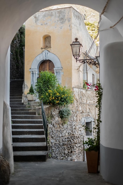 Cute old stony narrow streets with vintage houses in the village of Positano in southern Italy